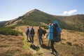 Hiker goes to the mountains on a sunset hike. Ecotourism Royalty Free Stock Photo