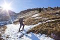 Hiker going up in the snowy mountain