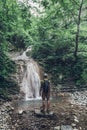 Hiker Has Reached Destination And Enjoying View Of Waterfall And Beauty Unspoilt Nature. Contemplation Adventure Concept Royalty Free Stock Photo