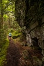 Hiker Heading Down Mossy Trail Royalty Free Stock Photo