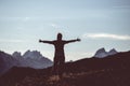 Hiker in high altitude rocky mountain landscape. Summer adventures on the Italian French Alps, toned image. Royalty Free Stock Photo