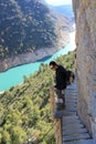 Hiker in the high of the mountain in a footpath