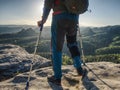 Hiker hold medicine stick, injured knee fixed in knee feature