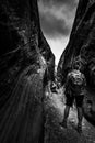 Hiker inside a slot canyon Utah Royalty Free Stock Photo