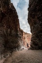 HIker Inspects The Dry Fall On Upper Burro Mesa Pouroff in Big Bend