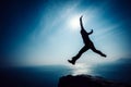 Hiker jumping on sunrise seaside Royalty Free Stock Photo