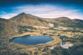 Hiker and the lake. Instagram stylisation Royalty Free Stock Photo