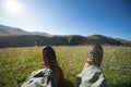 Hiker legs hiking in grassland mountains