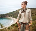 Hiker looking into the distance in front of ocean view landscape Royalty Free Stock Photo