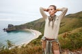 Hiker looking into the distance in front of ocean view landscape Royalty Free Stock Photo