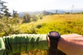 Hiker looking at electronic compass, travel and navigation Royalty Free Stock Photo
