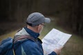 Hiker looking at map in forest Royalty Free Stock Photo