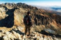 Hiker looking on mountains from top of the peak. View from hill Krivan in High Tatras mountains, Slovakia Royalty Free Stock Photo