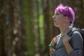 Hiker looks up a wood on a hike