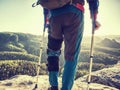 Hiker man with broken leg in immobilizer and crutches Royalty Free Stock Photo