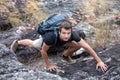 Hiker man climbing rock on mountain Royalty Free Stock Photo