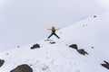 A hiker man jumping on the base of chimborazo Mountain in ecuador Royalty Free Stock Photo