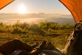 Hiker Man Sitting In A Tourist Tent by Travel Discovery Concept. Royalty Free Stock Photo