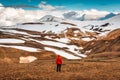 Hiker man standing at Kerlingarfjoll with volcano mountain in summer at Highlands of Iceland