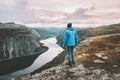 Hiker man traveling alone walking in sunset mountains