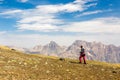 Hiker man walking on the mountain hill