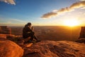 Hiker meets sunset at Grand view point in Canyonlands National p