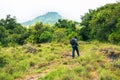 Rear view of hiker at Mount Gahinga in the Mgahinga Gorilla National Park, Uganda