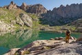 Hiker By Mountain Lake Royalty Free Stock Photo