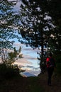 Hiker on a mountain trail at twilight, Radocelo mountain Royalty Free Stock Photo