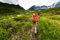 Hiker in the mountains on the Altai