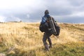 Hiker in the mountains with backpacks