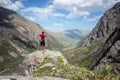 Hiker in the mountains overlooking the Midagrabin valley