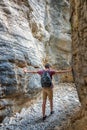 Hiker in a narrow trail of Imbros gorge, Crete Greece