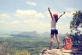 Hiker open arms on mountain peak Royalty Free Stock Photo