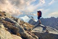 Hiker with backpack in the mountains Royalty Free Stock Photo
