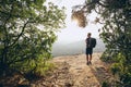 Hiker overlooking view from rock