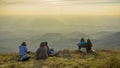 Hiker people take a rest and sit on mountain peak.with autumn mo Royalty Free Stock Photo