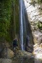 Hiker photographing waterfall