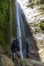 Hiker photographing waterfall