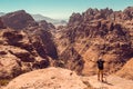 Hiker with raised hand impressed amazing view. Meditation nature. Achievement concept. Ecotourism. Copy space. Rocky mountain land Royalty Free Stock Photo