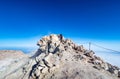 Hiker reaching the summit of active volcanic crater of Mount Teide on Tenerife in Canary Islands Royalty Free Stock Photo