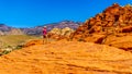 Hiker on the Red Sandstone Cliffs of the Calico Trail in Red Rock Canyon National Conservation Area, NV. USA Royalty Free Stock Photo