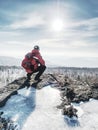 Hiker relaxing on top of hill and enjoying view Royalty Free Stock Photo