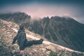 Hiker relaxing on top of a mountain. Instagram stylisation Royalty Free Stock Photo