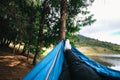 A hiker resting on his hammock after a long hike