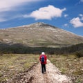 Hiker on the road to the mountain Rtanj in Serbia Royalty Free Stock Photo