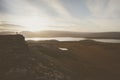 Hiker on a rocky cliff during the sunset. Great atmosphere with