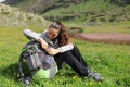 Hiker searching something in backpack