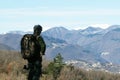 Hiker senior man with backpack and camera standing on the mountain top - Active traveler pensioner with grey hair  - Discovery Royalty Free Stock Photo