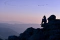 Hiker sitting on rock